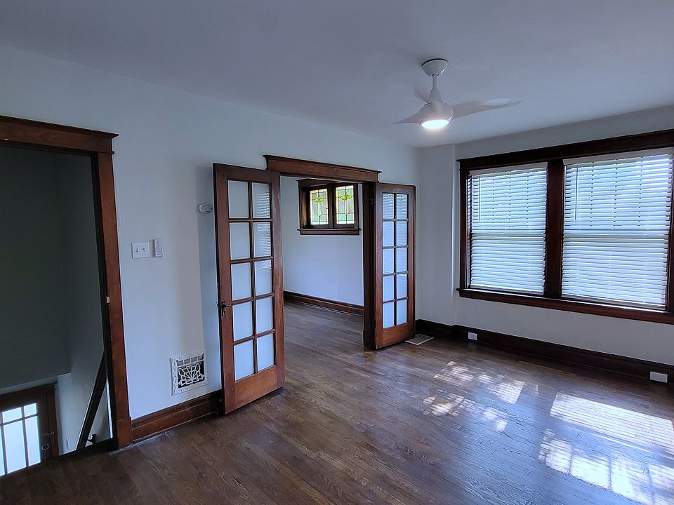 Private stairs entrace to the left. Living area in front and primary bedroom through French doors. Featuring new Levolor faux-wood blinds and Minka ceiling fans throughout.