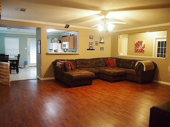 open and spacious family room with laminate flooring