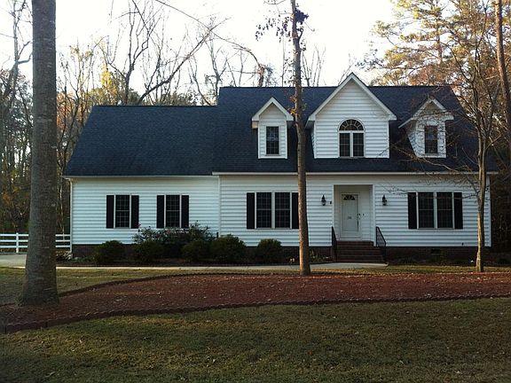 Front view, backs up to woods