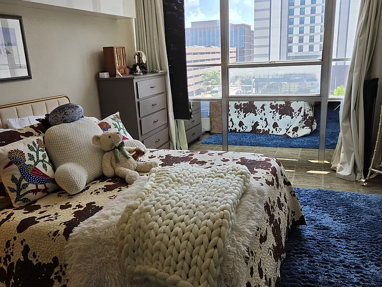 Large bedroom with downtown views