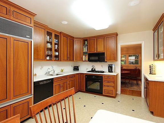 Kitchen has built in table with bench