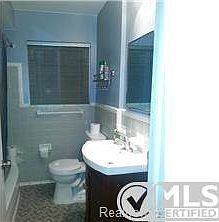 new vanity, lighting and fixtures in bathroom