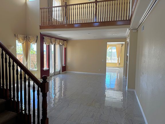 Stairs leading to upstairs and view of the upstairs loft Office/Workspace