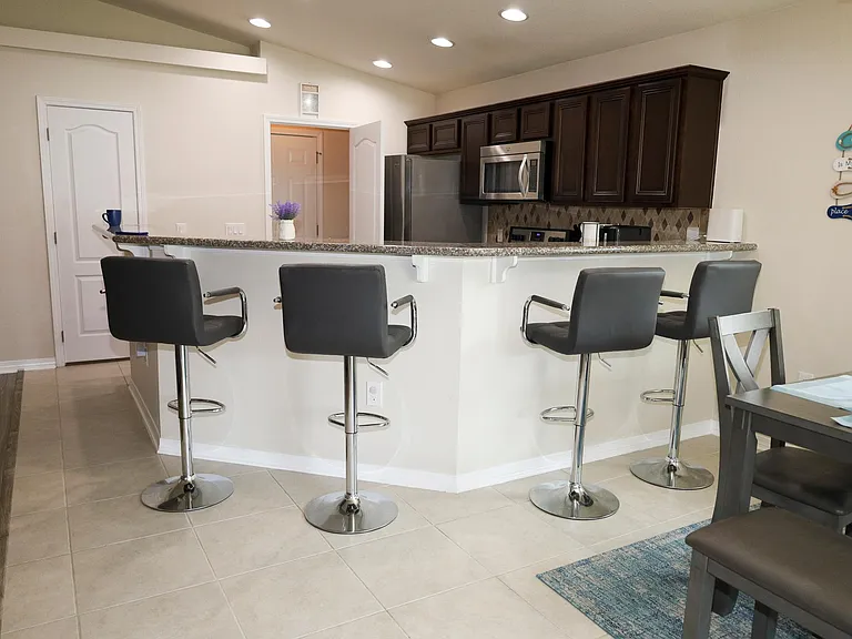 Bar stools for quick bites and a full dining area for family meals_we've got all your dining needs covered!