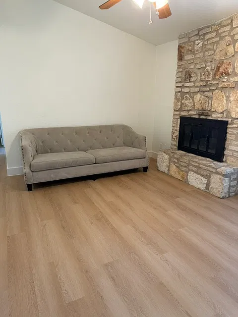 Living room with wood burning fireplace