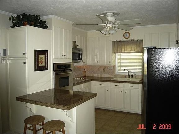 Updated Kitchen has granite counter tops, new plumbing & stainless appliances.