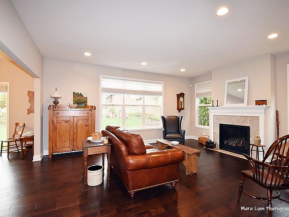 Large, open great room with volume ceiling and lov