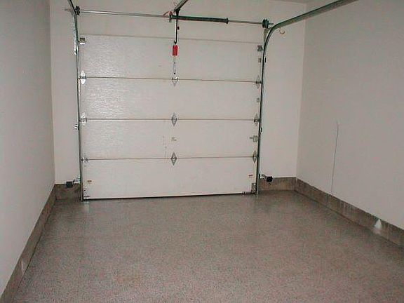 Insulated garage with laundry hook ups and extra storage.