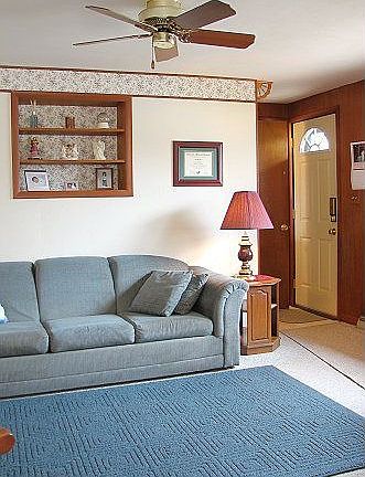 Carpeted Family Room with Ceiling Fan