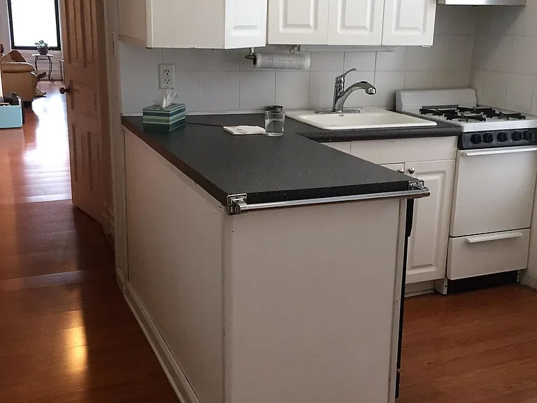 Eat-in kitchen with dishwasher, microwave, large pantry, and built-in china hutch.