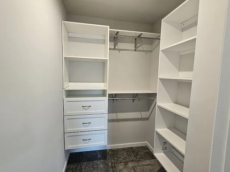 Bedroom #2's Closet w/ built-in drawers + shelves
