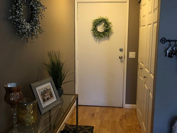 Entry way. Built in shelves in entry way closet