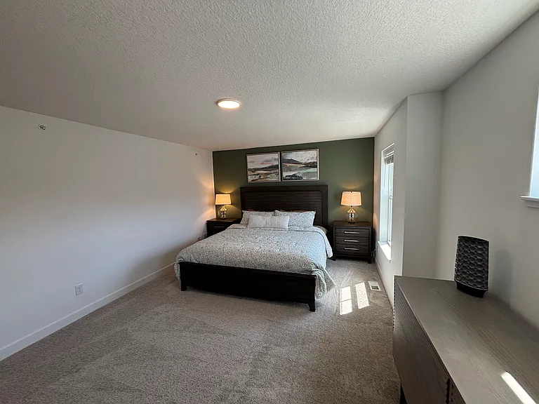 Master Bedroom shown in model-home photos for illustration purposes only. Actual home may vary in finishes, colors, and upgrades.