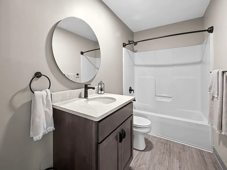 Beautiful Full Bathroom with Hardwood Style Flooring