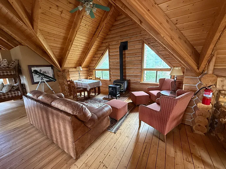 Top floor sitting area with wood-burning stove