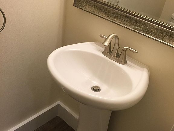 Main floor half-bath with sink and toilet