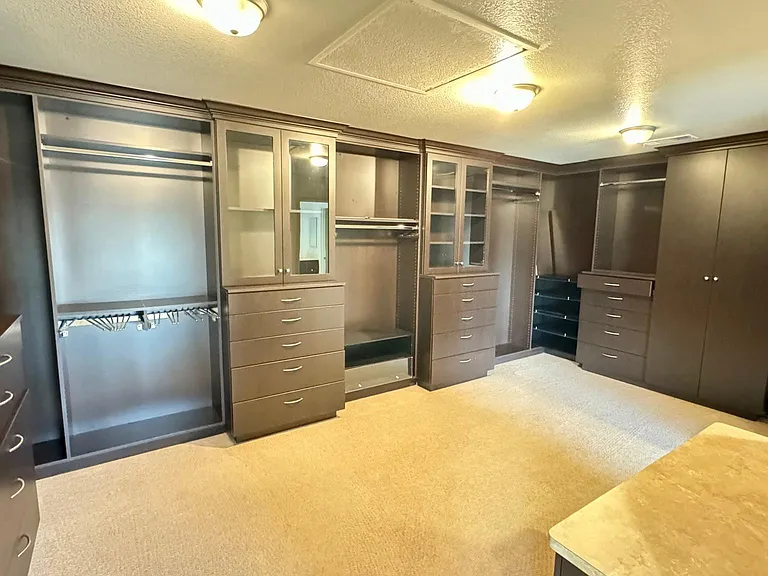 Master Closet with cabinets and drawers