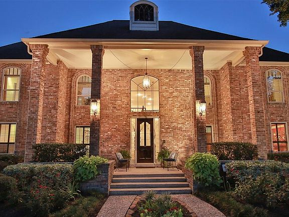 STATELY FRONT BRICK ENTRANCE WITH A VIEW OF THE SWEEPING FRONT PORCH. You will enjoy countless days watching your kids or dogs play in this perfectly tucked away home that backs up to a natural preserve. You will own 1/20th interest in a beautiful 16