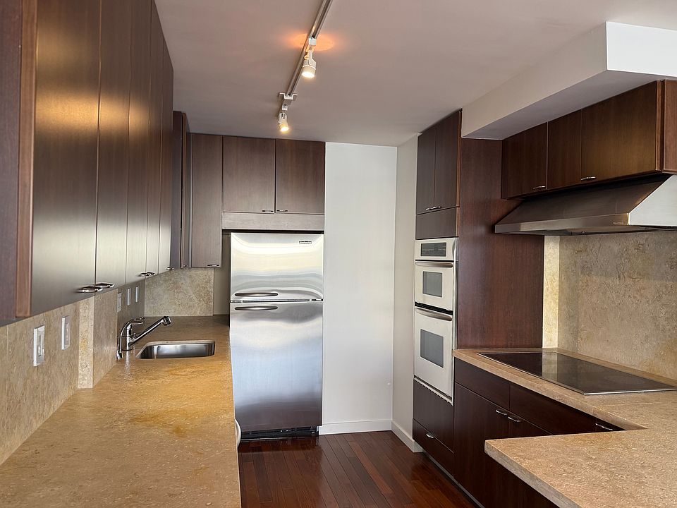 kitchen (including: fridge, freezer, electric stovetop, dishwasher, two ovens)