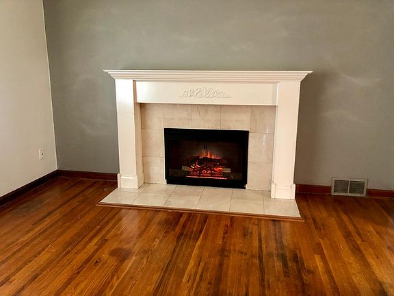 Fireplace with heater, crackling wood sounds and an adjustable glow