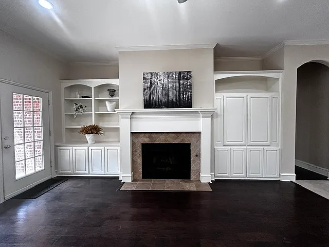 Living room with gas fireplace and custom built-ins