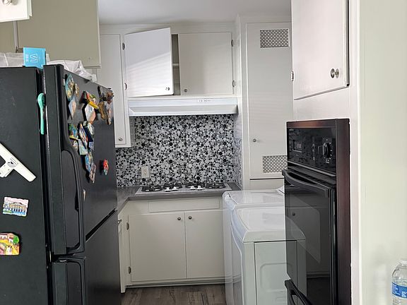 Kitchen with Fridge, Stove, and Laundry Hookups