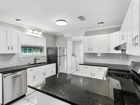 Updated kitchen with granite countertops, stainless steel appliances