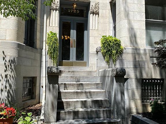 Main entrance to graystone building constructed in late 19th century. Unit is on the ground floor, to the right of the entrance.
