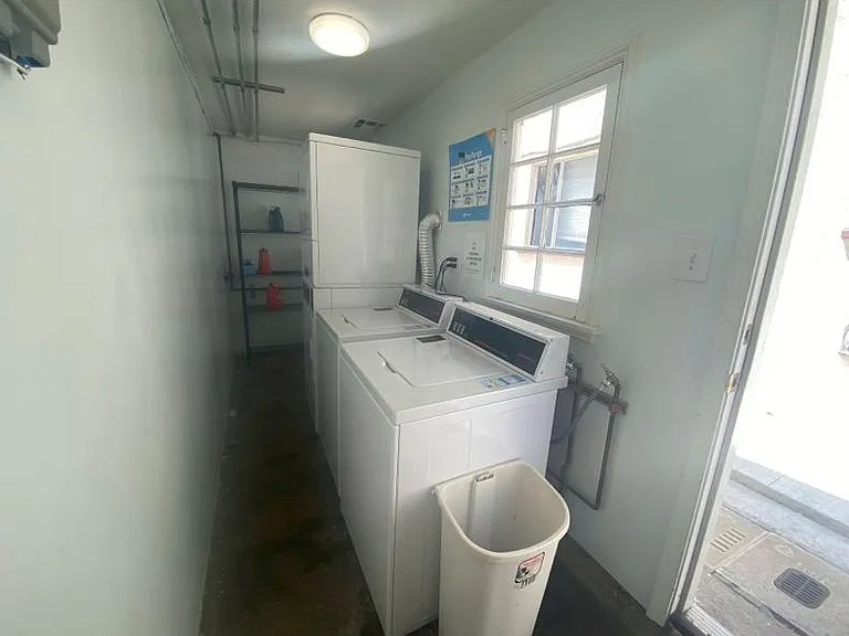 Laundry room/ 2 washers / 2 dryers and a clothes line.