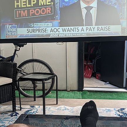 Under gazebo watching TV