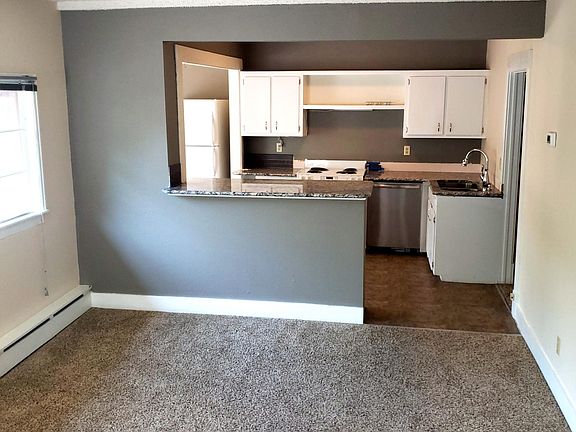 bar area between kitchen and living room, new granite