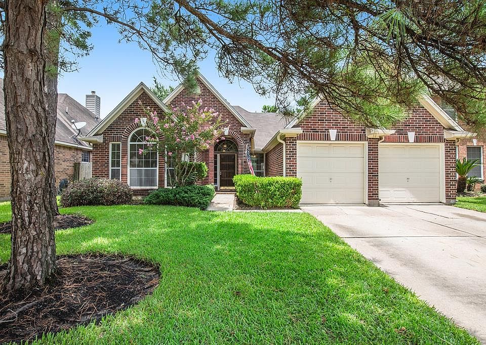 Welcome home to 17118 Coral Cove Court nestled on a cul-de-sac street in Copper Lakes!
