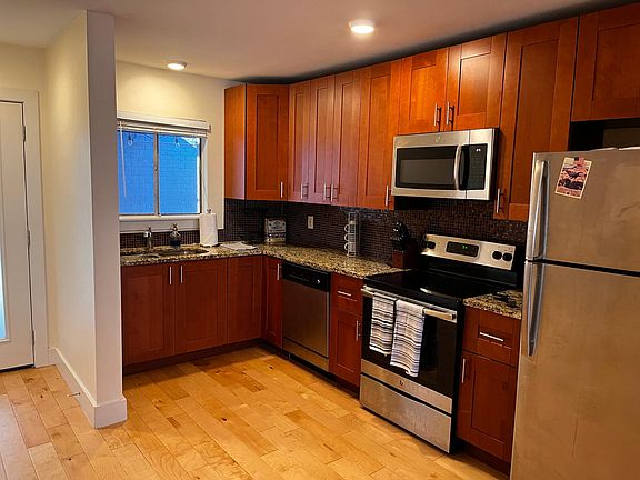 A kitchen with plenty of counter space and natural lighting.