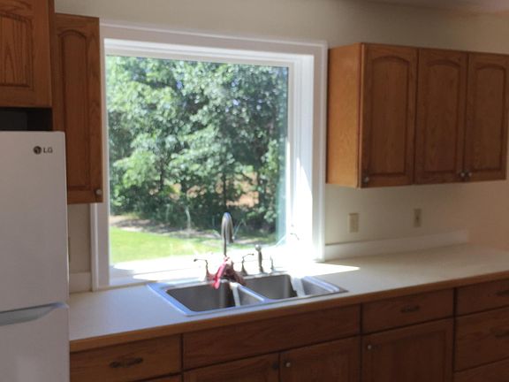 View of kitchen on through southern exposure window.