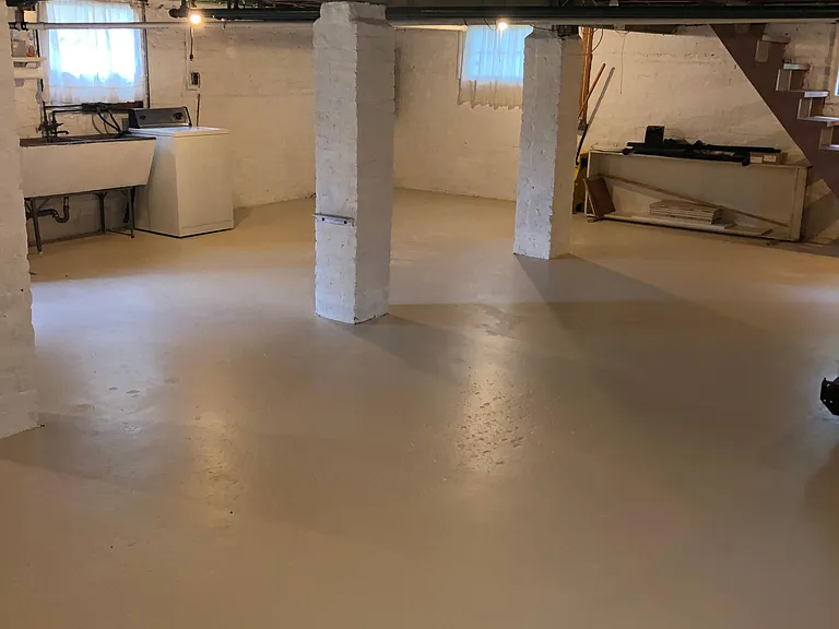 Unfinished Lower Level with washer and dryer, utility sink