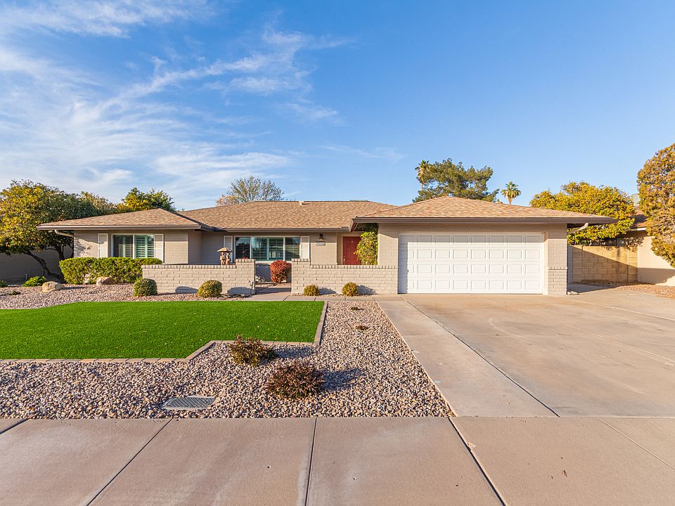 Great curb appeal with low maintenance landscape and plenty of parking