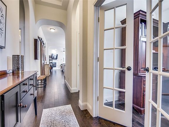 As you enter the home you are greeted with upgraded wood flooring throughout! Notice the handsome study off the entry as you enter as well!