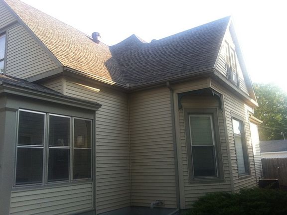 Side of the home displaying new roof