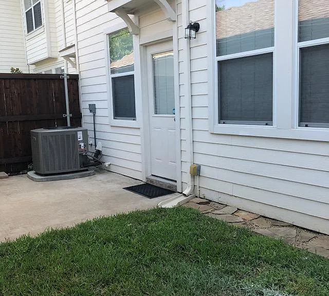 Small, private backyard area leads to your two car garage and is a great place to grill and enjoy! HOA takes care of all exterior landscaping, mowing and watering.