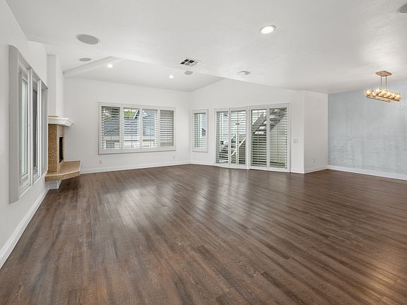 Living room with view to stairs going to private rooftop deck