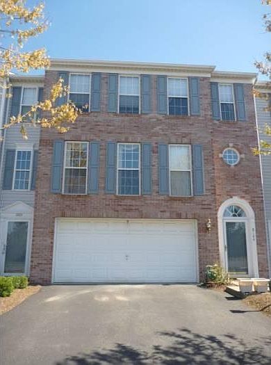 Front with 2 car garage