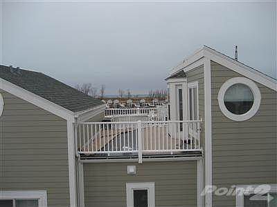 Enjoy Lake Michigan sunsets from your upper balcony! ...or just relax and enjoy the harbor, boats an