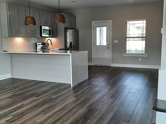 Another view of Kitchen with a Nook area with good natural light.