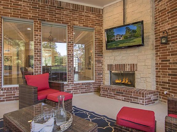 Fabulous screened in porch with fireplace offers year round entertaining.