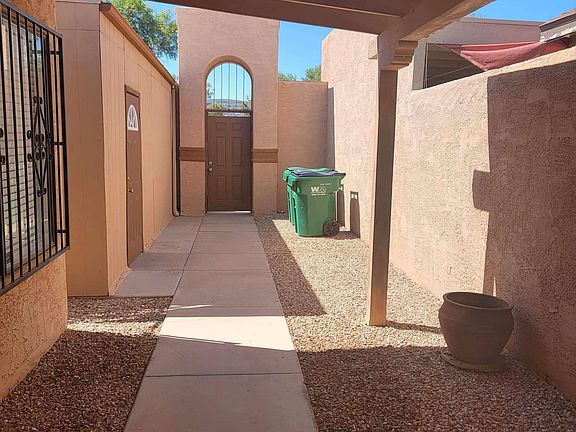 Covered front patio. Low maintenance yard has cement & gravel.