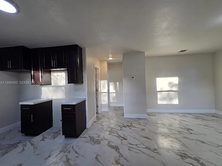 295 NW 48th St — Photo 3