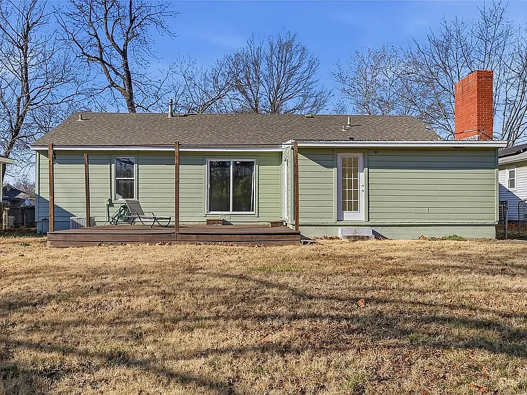Private backyard with a spacious patio, perfect for outdoor entertaining, relaxing, grilling, or enjoying beautiful Oklahoma evenings.