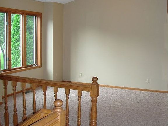 Living Room has vaulted cieling, new carpet and fresh paint.