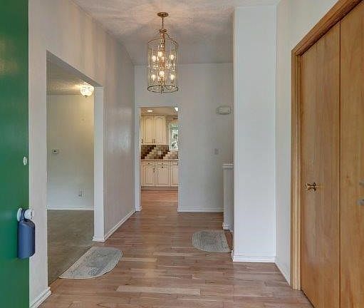 Entry with hardwood floors.