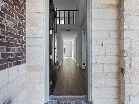 Feel at home from the start-an inviting entryway leads you into the heart of the open living area.